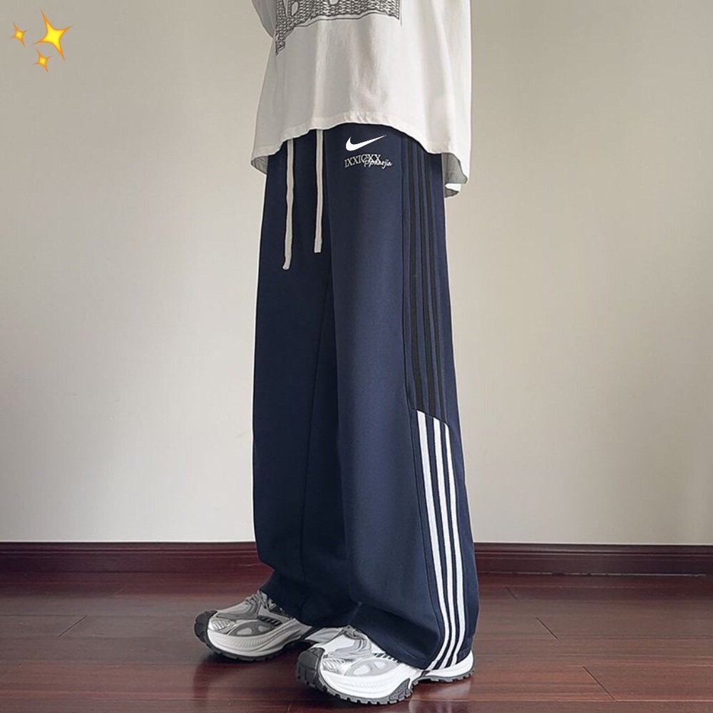 Nike Men's Navy Joggers with White Stripes